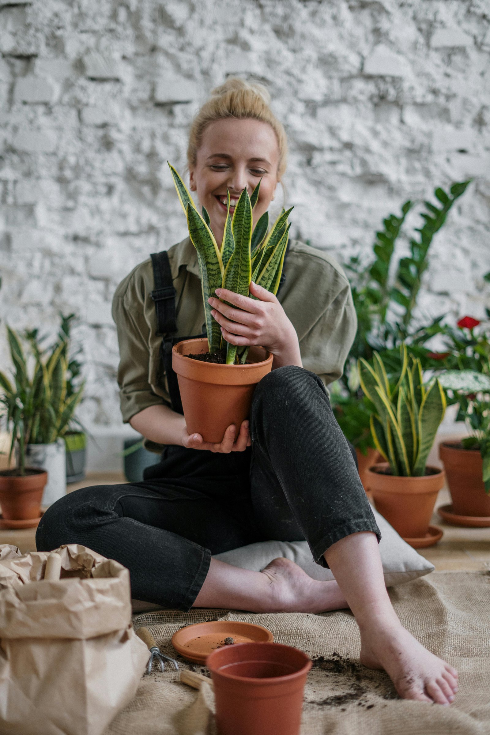 A smiling women enjoying creating her own garden